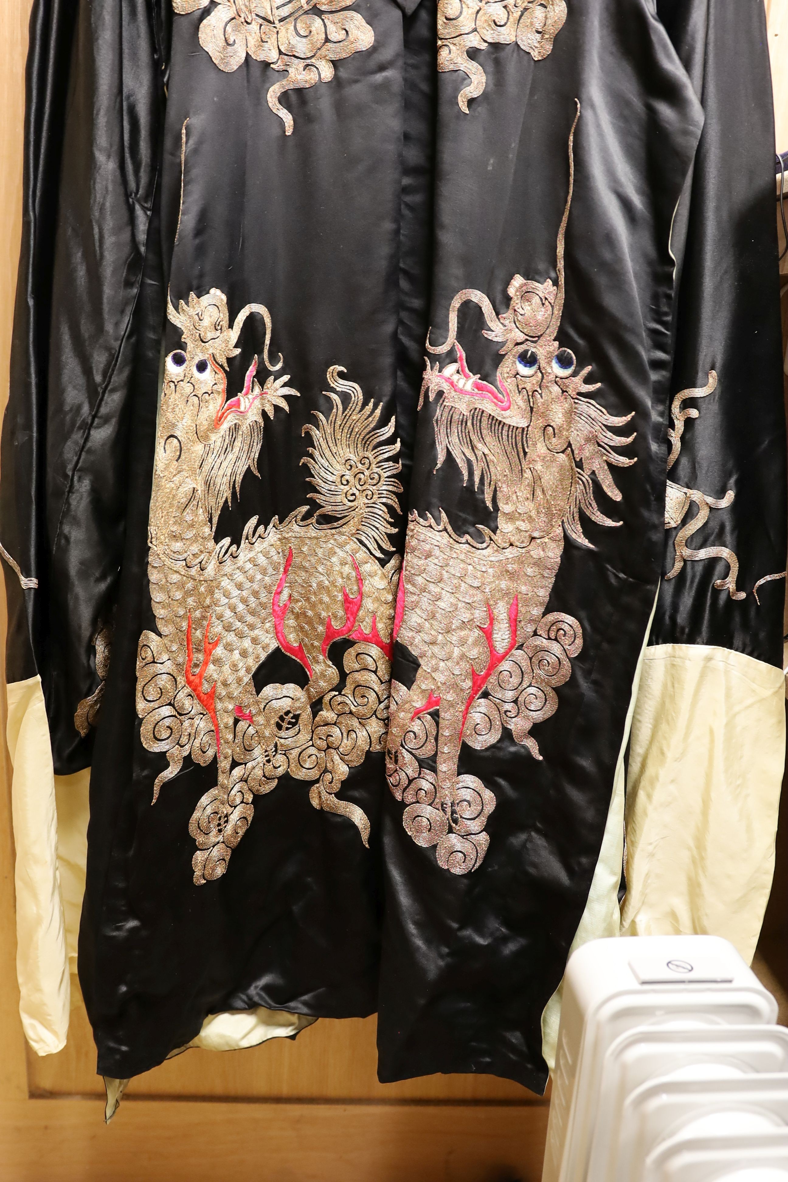 A Chinese black silk and silver thread robe, 44cm across shoulders